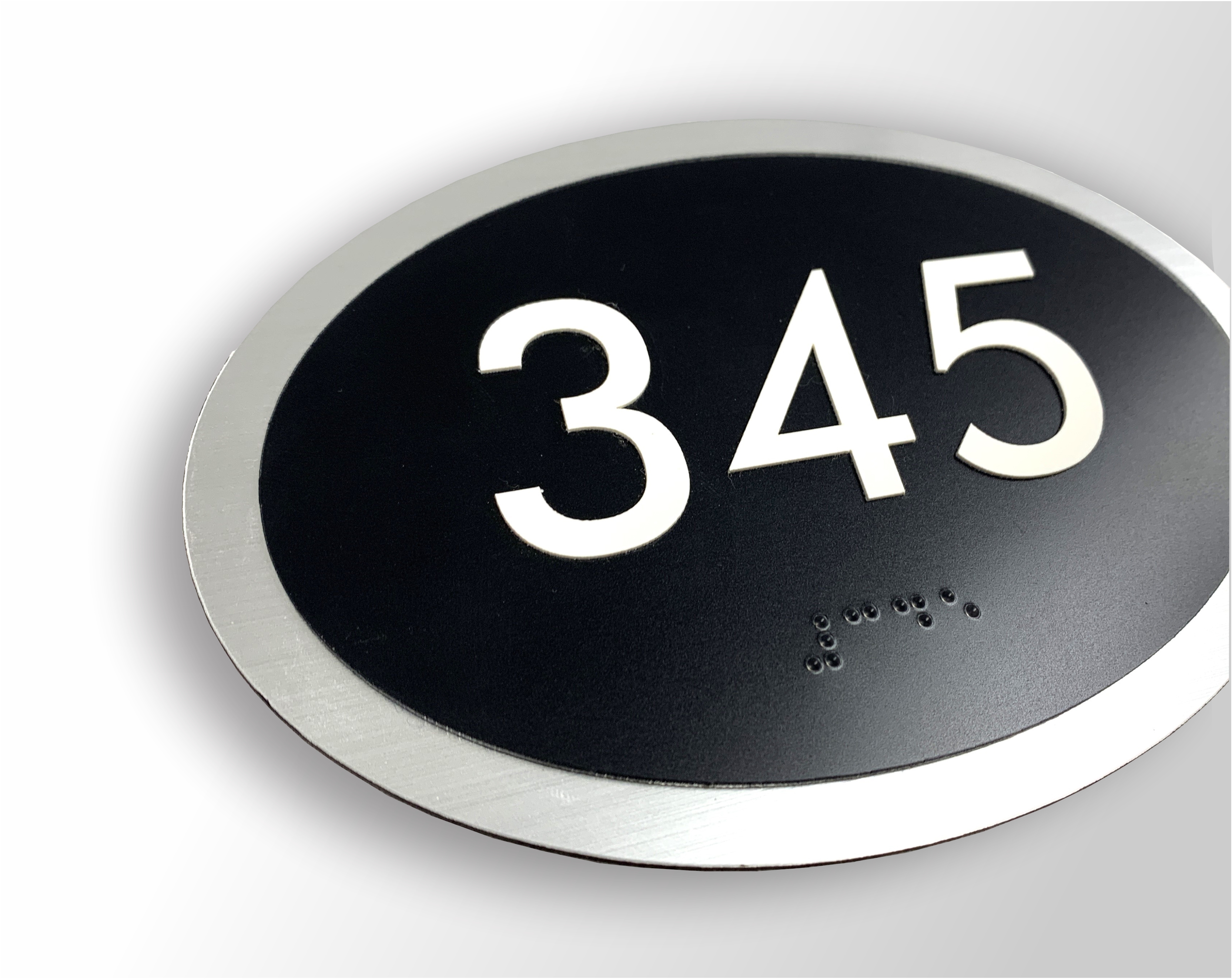 Elliptical Sign Series for ADA compliance, a distinctive oval shaped architectural braille sign system with raised text and braille 